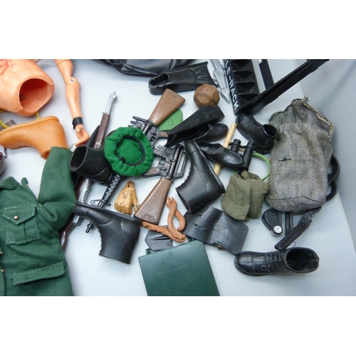 828 - A collection of Action Man 1960s clothes and accessories including rifle rack, helmets, guns, dinghy... 