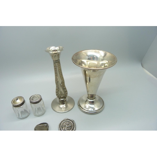 834 - A small silver topped salt and pepper pair, a/f, an Isle of Man brooch lacking pin, a ring made from... 