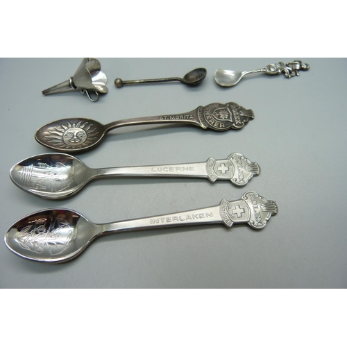 864 - Two silver condiment spoons, a silver scent bottle funnel, marked 925 and three Rolex spoons