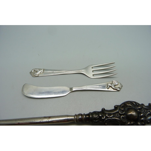 865 - A small continental silver knife and fork with cockerel motif to handle, a silver pickle fork and a ... 