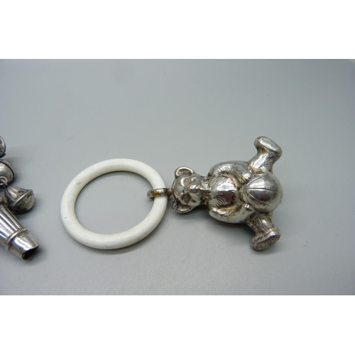 866 - A Victorian silver rattle/whistle, Birmingham 1896, a Teddy bear rattle and a cat rattle