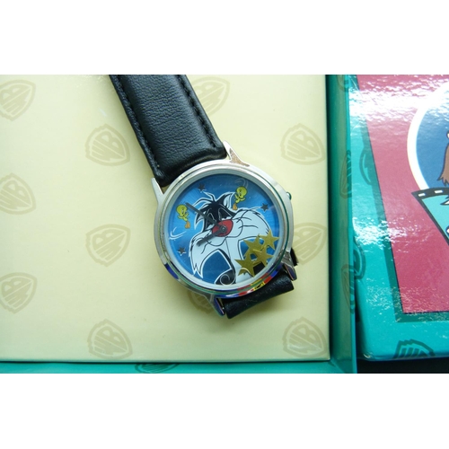 878 - Two novelty Looney Tunes wristwatches and a pen