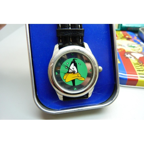 878 - Two novelty Looney Tunes wristwatches and a pen