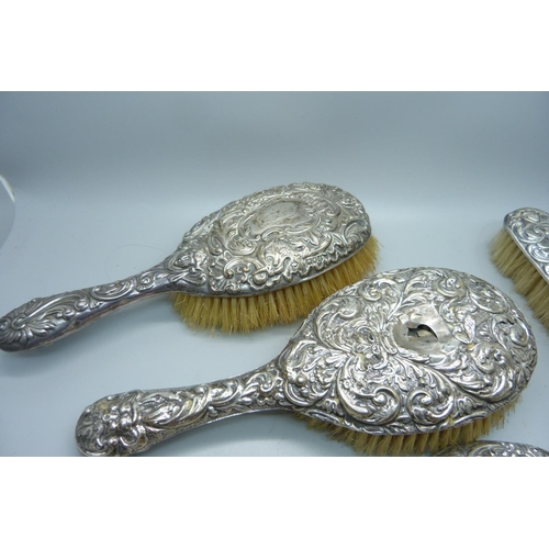 912 - A silver backed mirror and brushes, a/f