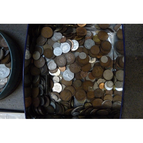 921 - A collection of coins, (in two tins)