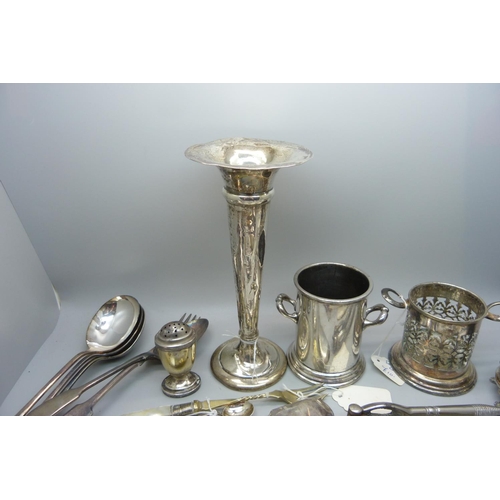 925 - A collection of plated ware including cutlery and condiments, a silver posy vase and a silver pepper... 