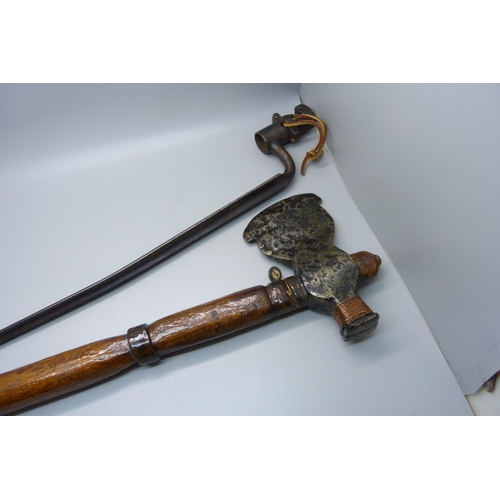 928 - An 18th Century French bayonet and an axe