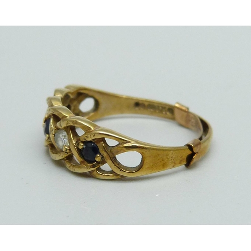 944 - A 9ct gold, sapphire and zircon ring with sizing clip, 2.5g, Q