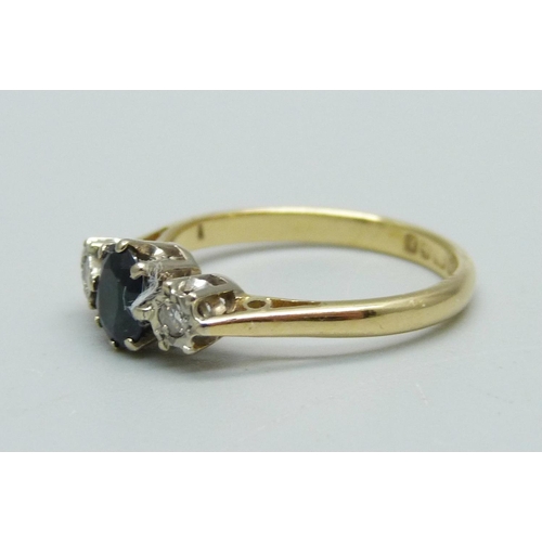 964 - An 18ct gold, sapphire and diamond three stone ring, 2.7g, L