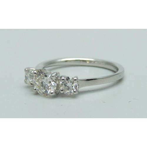 974 - A platinum and three stone diamond ring, marked Plat, total diamond weight 1.14ct, (centre diamond 0... 