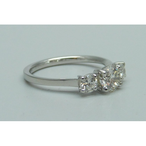 974 - A platinum and three stone diamond ring, marked Plat, total diamond weight 1.14ct, (centre diamond 0... 