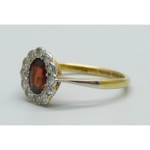 980 - An 18ct gold, diamond and red stone ring, 2.4g, N