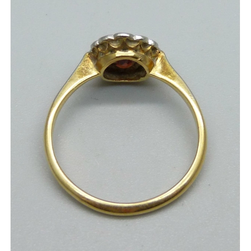 980 - An 18ct gold, diamond and red stone ring, 2.4g, N