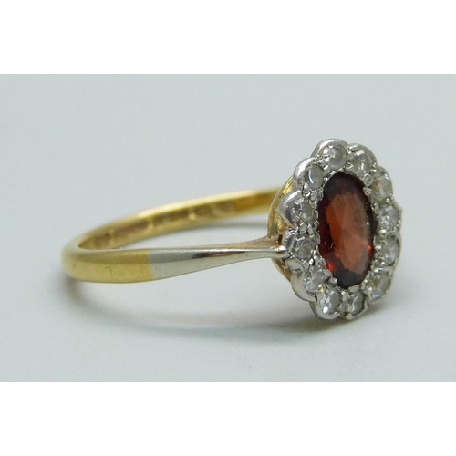 980 - An 18ct gold, diamond and red stone ring, 2.4g, N