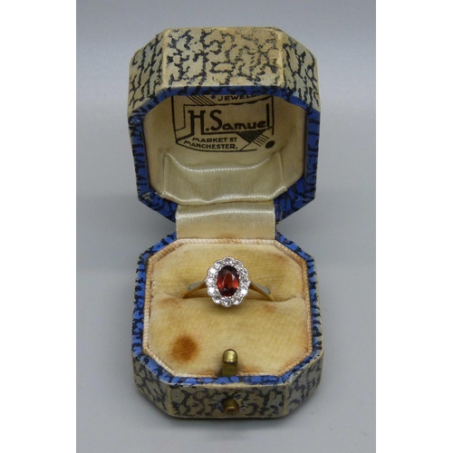 980 - An 18ct gold, diamond and red stone ring, 2.4g, N