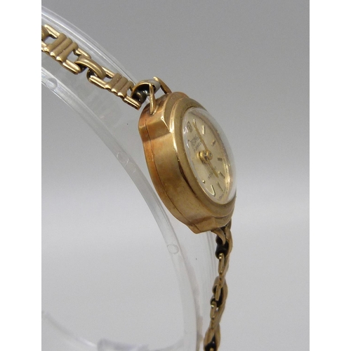 987 - A lady's 9ct gold Precimax wristwatch on a 9ct gold strap, total weight with movement 12g, boxed