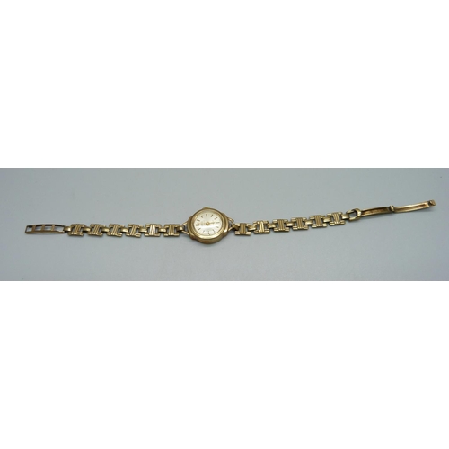 987 - A lady's 9ct gold Precimax wristwatch on a 9ct gold strap, total weight with movement 12g, boxed