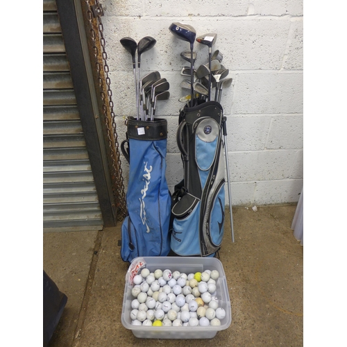 2228 - 3 golf bags with quantity of woods, irons and golf trolley with a tub of Approx. 150 golf balls