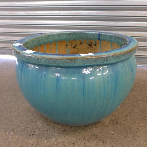 2230A - A set of three blue glazed planters