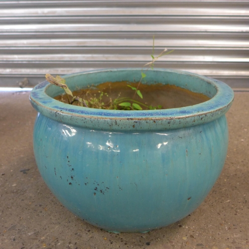 2230A - A set of three blue glazed planters