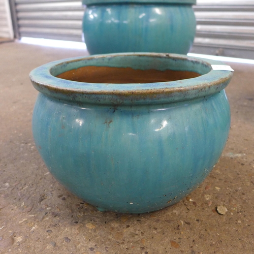 2230A - A set of three blue glazed planters