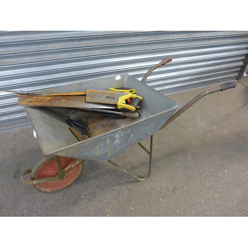 2238 - Two GS axle stands, a wheelbarrow and a quantity of handsaws