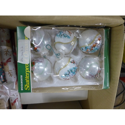 2384 - A quantity of Christmas baubles, wrapping paper, tags, etc.