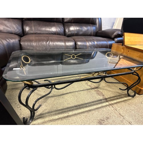 1636 - A metal and glass topped coffee table