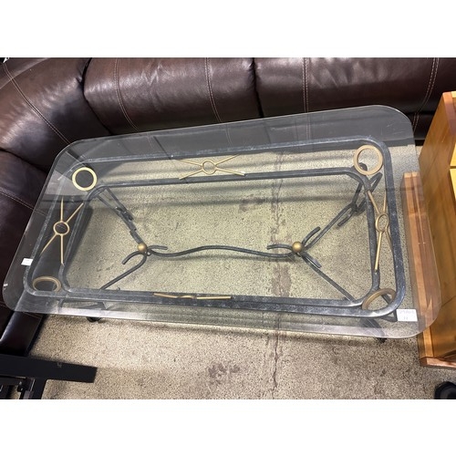 1636 - A metal and glass topped coffee table