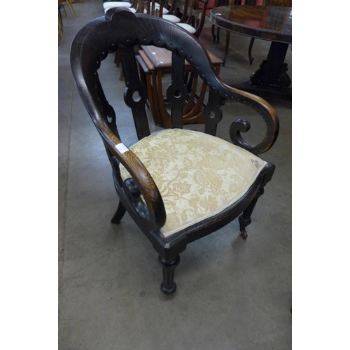 104 - A Victorian Gothic Revival elm library chair