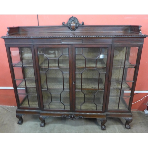 106 - An Edward VII Chippendale Revival carved mahogany breakfront side cabinet