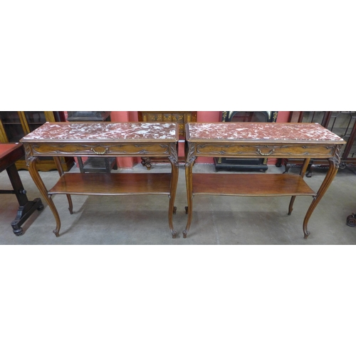 120 - A pair of 19th Century French walnut and marble topped single drawer two tier serving tables