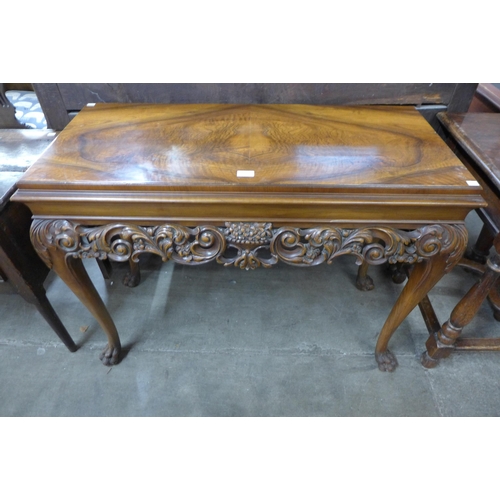 134 - An Italian Rococo style carved walnut console table