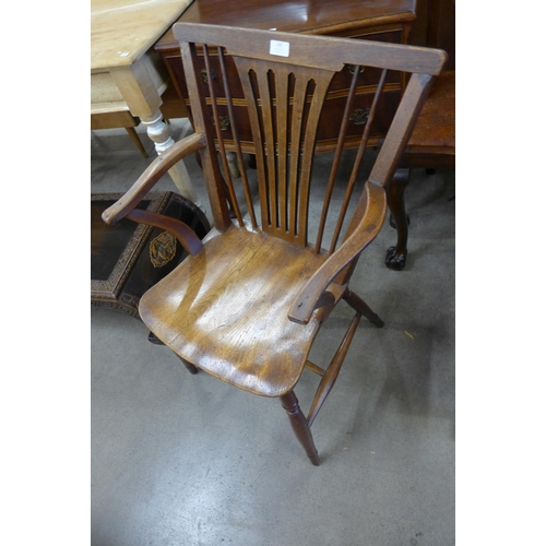 166 - An 18th Century elm and fruitwood elbow chair