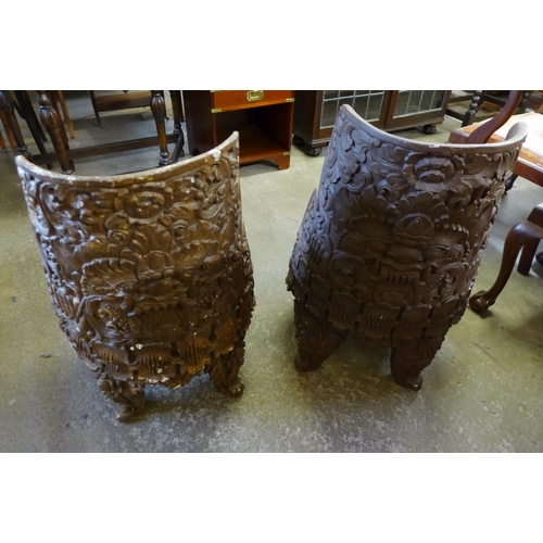 169 - A pair of Chinese carved wood chairs