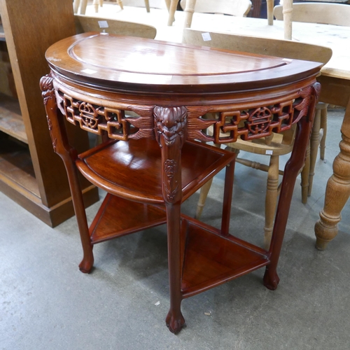 191 - A Chinese carved hardwood demi-lune side table