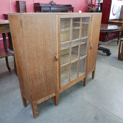 192 - An Art Deco Fyne Ladye oak bookcase, retailed by Heals