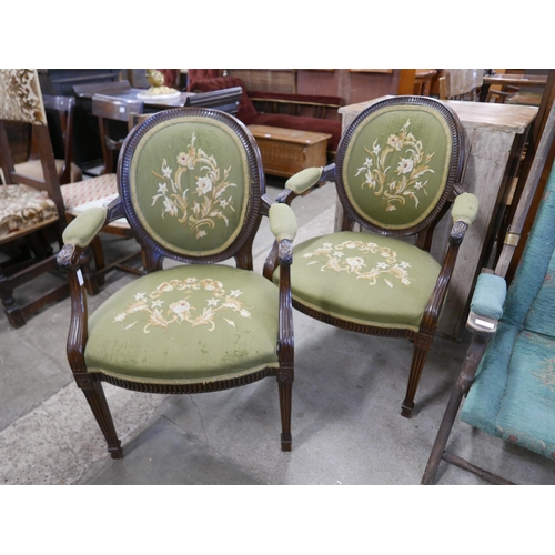 207 - A pair of French carved mahogany and fabric upholstered fauteuil chairs