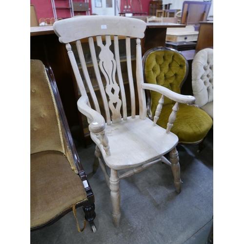 211 - A Victorian style beech farmhouse armchair