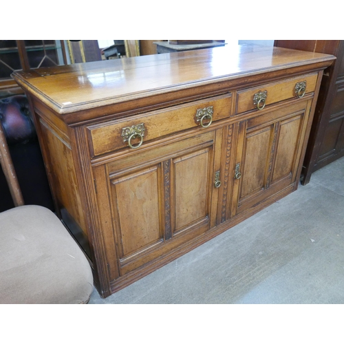 239 - A late Victorian carved walnut sideboard