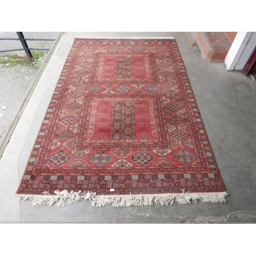 250 - A Belgian terracotta ground rug, 300 x 200cms