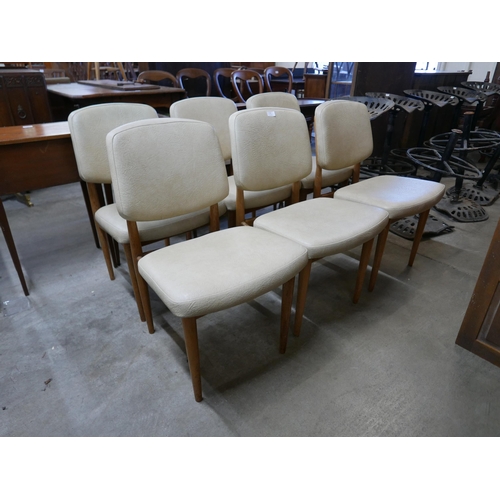 264 - A set of six light elm and cream vinyl chairs