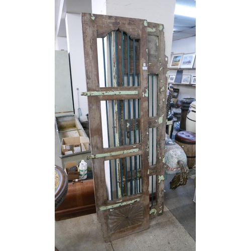 292 - A pair of Indian hardwood shutter doors