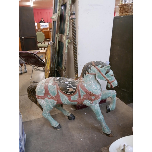 295 - A Folk Art style painted wooden fairground horse