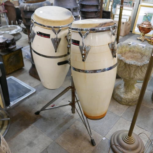 299 - A pair of percussion drums on stand