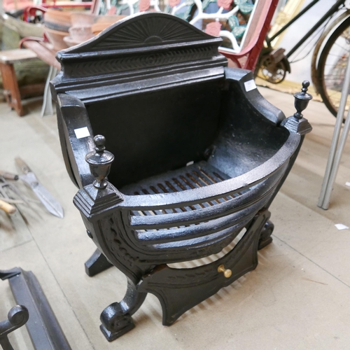 310 - A Victorian walnut coal scuttle, a cast iron fire grate, two fire baskets and a fender