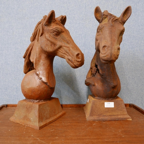 328 - A pair of cast iron horse's head garden ornaments