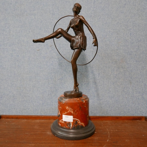 333 - An Art Deco style bronze figure of a female dancing hoop girl, on rouge marble socle