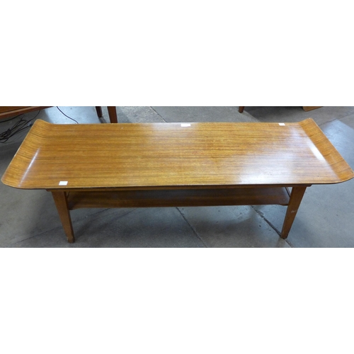 36 - A teak sleigh top coffee table