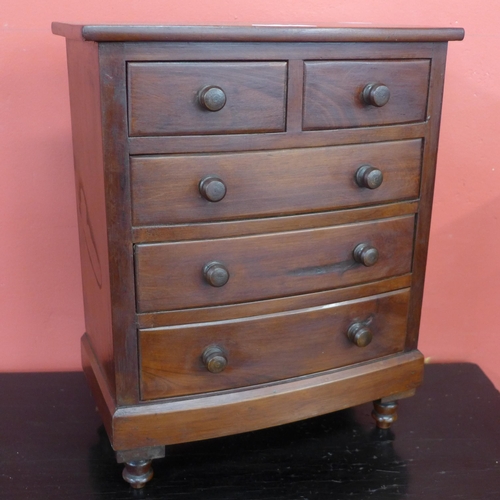 441 - A Victorian style mahogany apprentice's/miniature bow front chest of drawers